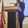 Xavier Epps of XNE Financial Advising at the 2014 High Tea Society Civili-Tea Event Introducing Honorable Jeffrey Slavin, Mayor of Somerset, MD